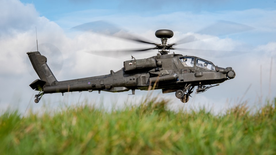  An Army Air Corps Apache Attack Helicopter prowling around Salisbury Plain Training Area at low level