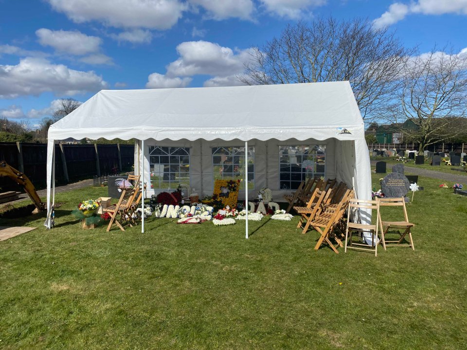  A group gathered in a 20ft by 8ft marquee beside the grave for Alfred