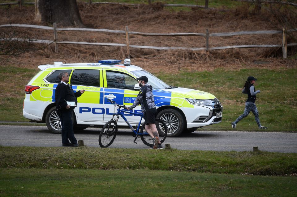  A policeman was seen talking to a member of the public in Richmond Park, London