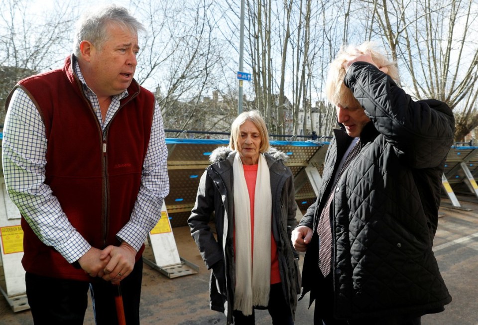  The PM speaks with locals