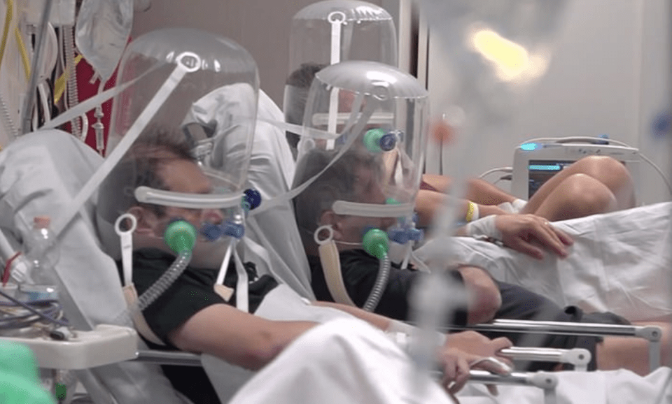  Patients in northern Italy wear bubble-like apparatus on their heads to help with their breathing