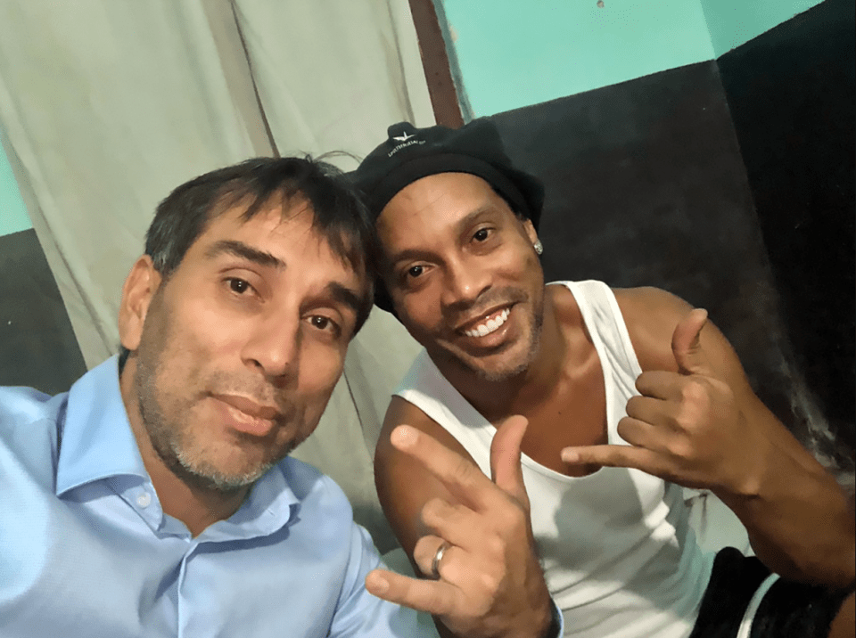  Ronaldinho is said to be 'sad' in jail but managed a smile alongside former Paraguay striker Nelson Cuevas