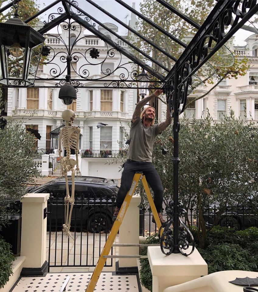 The entryway to the London home is very grand with intricate rails and lamps