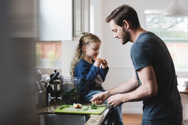 Dad cooking with daughter