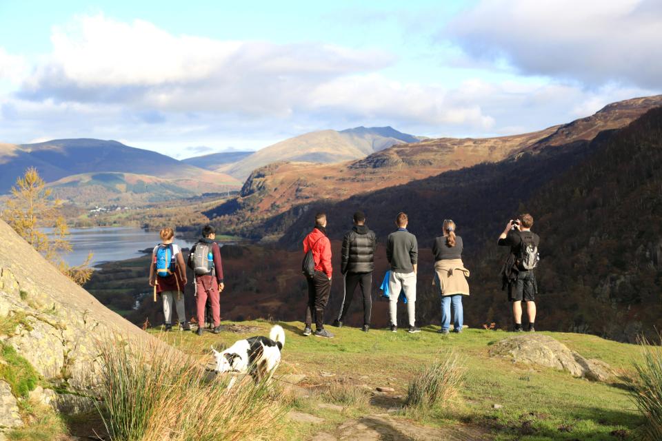  A group of young people enjoy a view in the Lake District. Police recently revised the rules on visiting the countryside during the lockdown