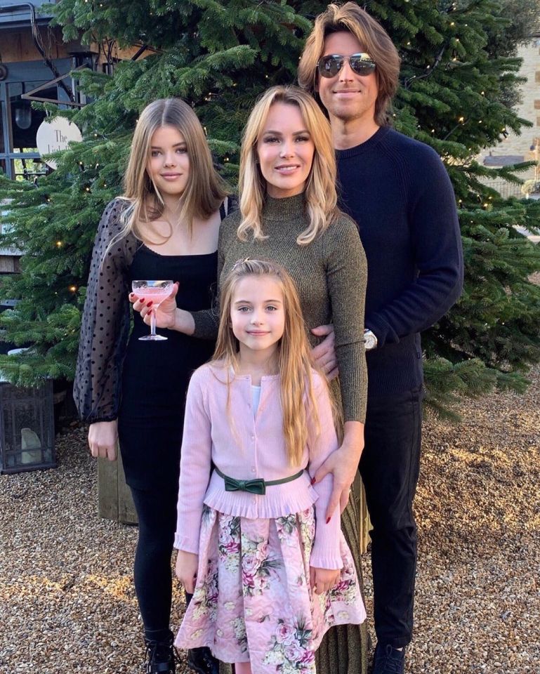  Amanda with husband Chris, and children Lexi and Holly