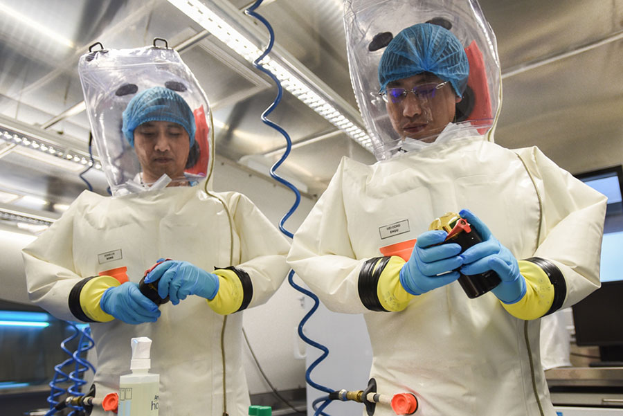  Scientists at the Wuhan Virology Institute wear high-grade hazmat suits (stock image)