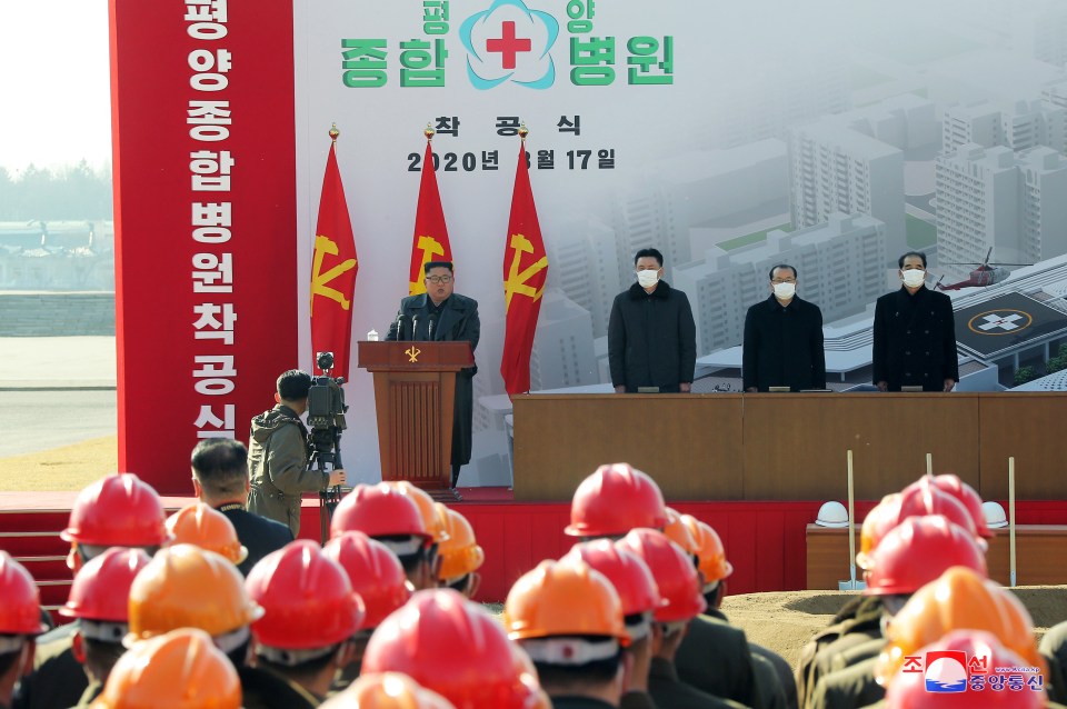  Party officials are seen wearing masks in a photo thought to have been taken in March this year