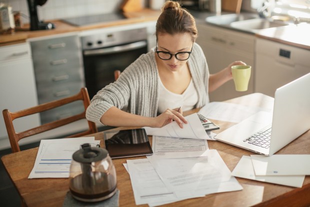 Woman looking at bills