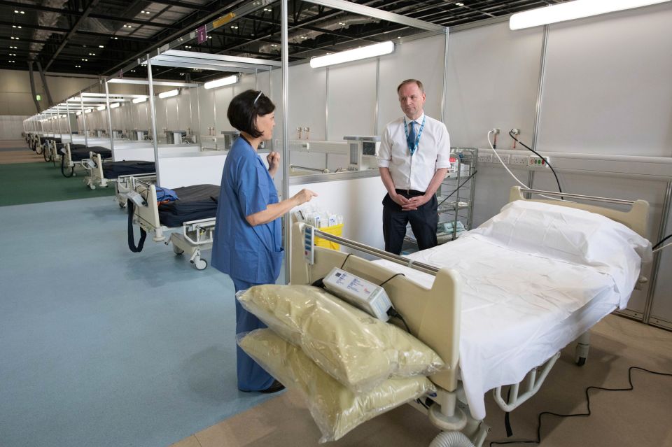  NHS England's chief executive Simon Stevens is shown around NHS Nightingale on March 30