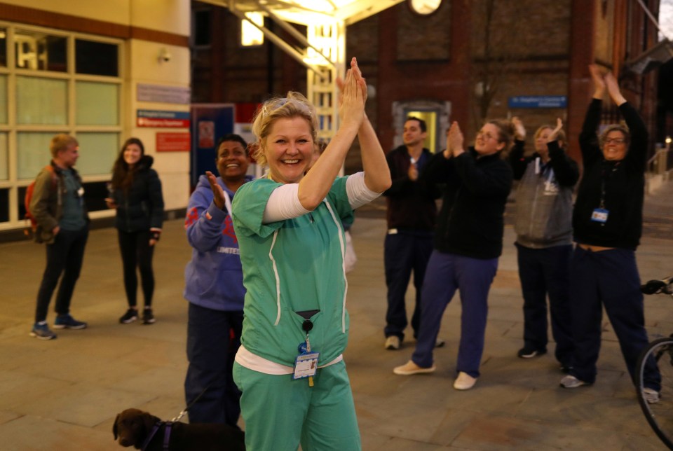  A jubilant NHS worker joins in with the country-wide clap for staff