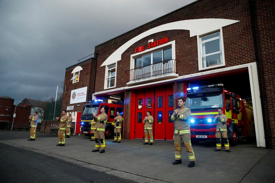  Firefighters lined up and put their blue lights on to join the round of applause