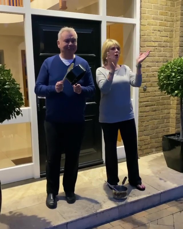  Ruth Langsford and Eamonn Holmes stand outside their home and clap at 8pm