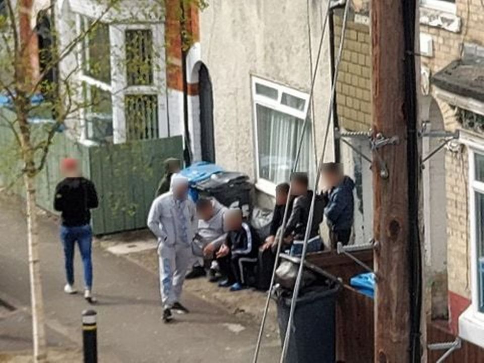  A group of lads ignore social distancing as the sit closely together outside a house in Hull