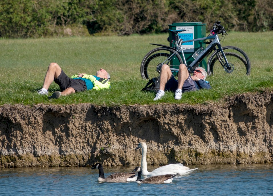  Two men sun bathe in Cambridge today