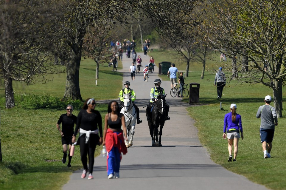 Police on horseback patrol Regents Park in London