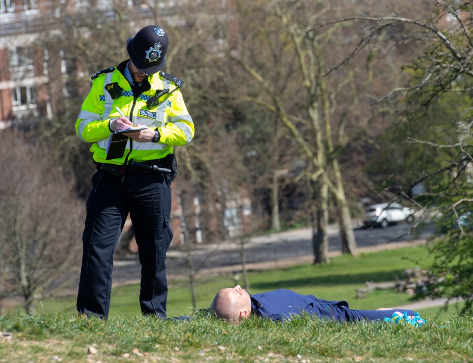  Police tell off sunbathers in the park