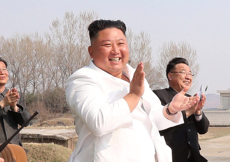  Kim Jong-un applauds as he visits a military base in pictures released on April 12