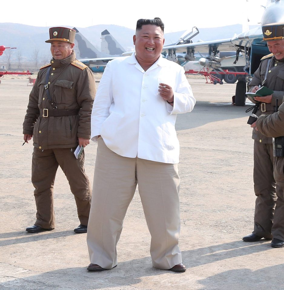  Kim Jong-un has a smoke while visiting a military base this month