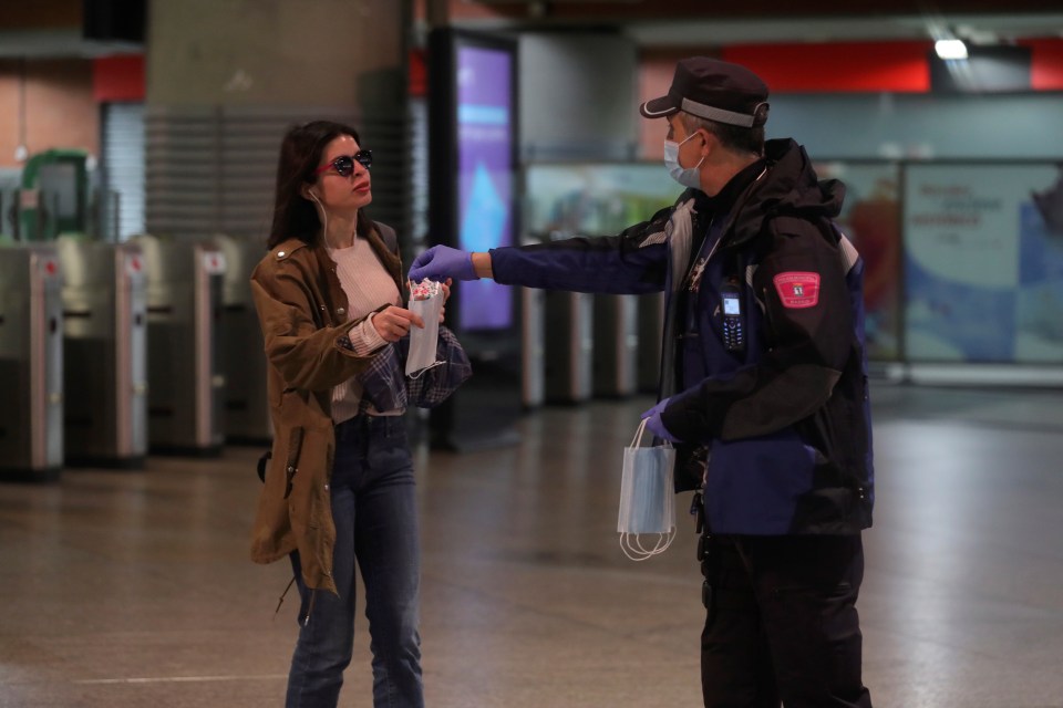  Around 35,000 police officers have been handing out masks across Spain