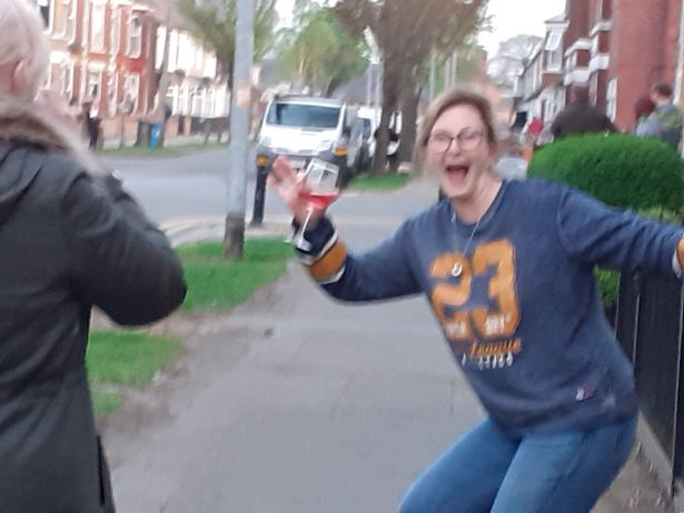  A woman celebrates during the raucous street party in Hull last Friday