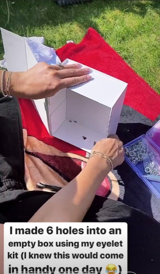 She drilled holes in a plain white box using her eyelet kit