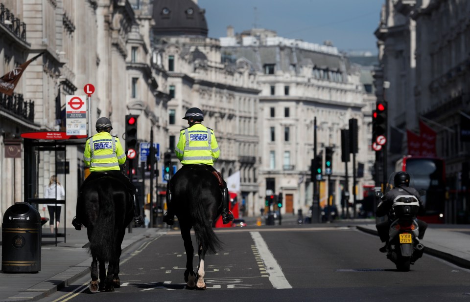 Police patrolling the empty streets in London