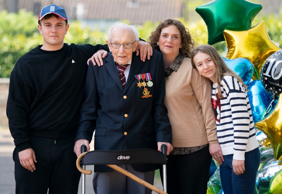  Captain Tom poses with his family, daughter Hannah and grand kids Benjie, 16 and Georgia, 11