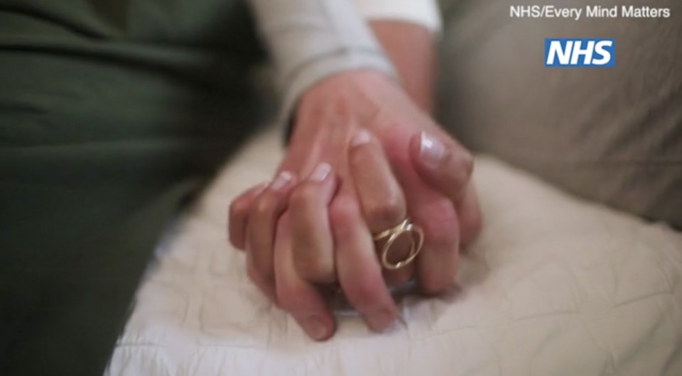  Two people holding hands appear in the powerful video