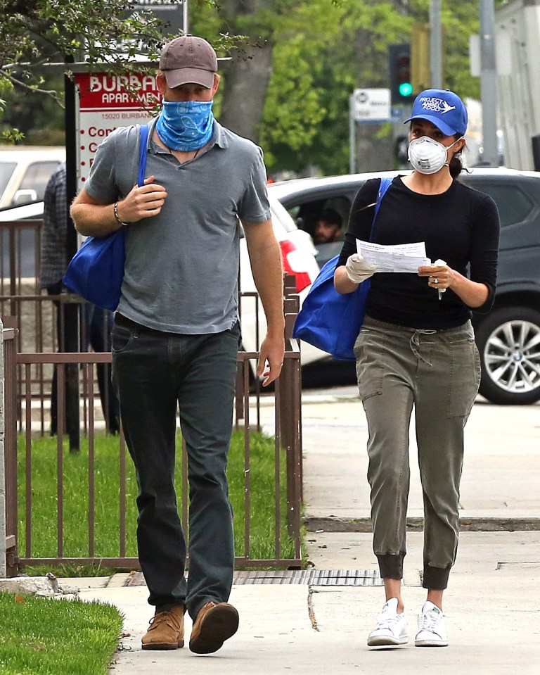  Harry and Meghan were seen this week delivering meals to residents in need during the coronavirus pandemic - wearing face coverings