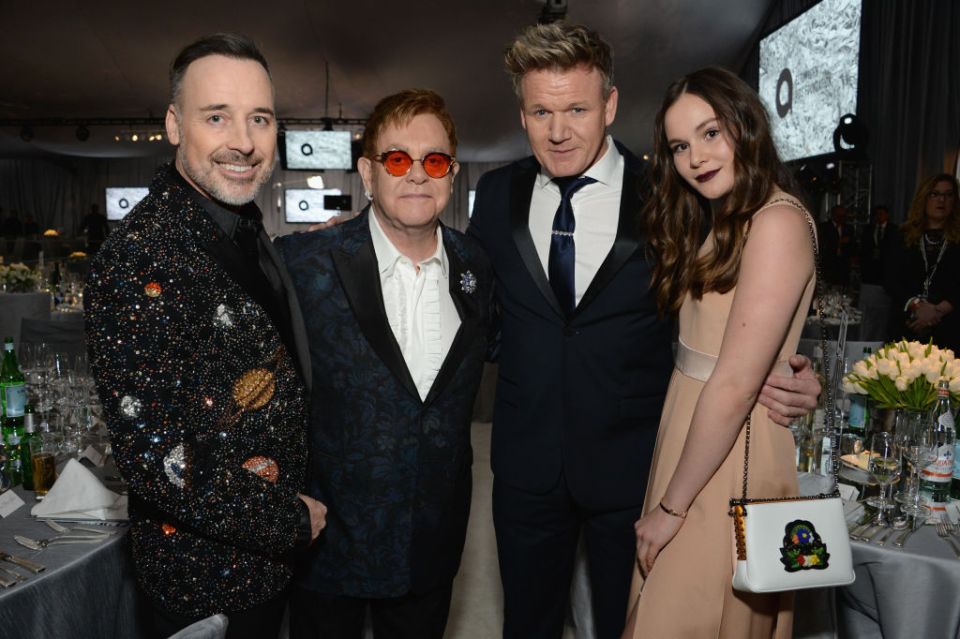 Pictured with hosts David Furnish, Elton John and her dad at the star studded bash