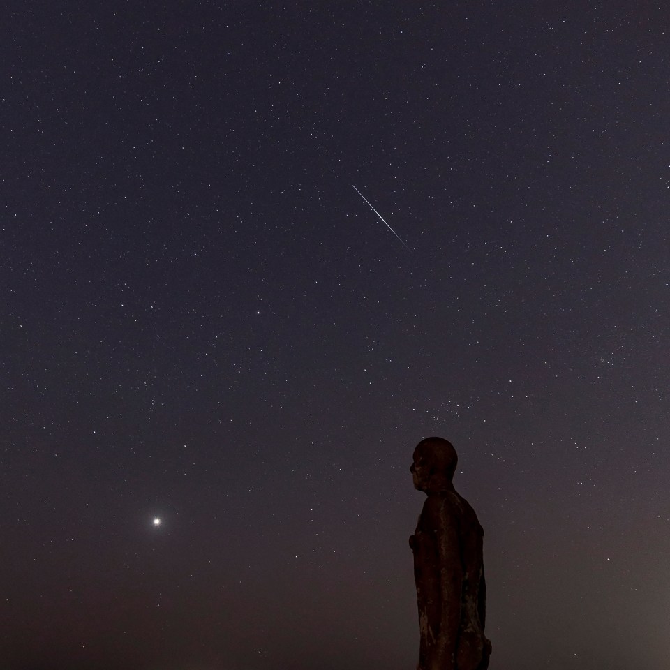  A Lyrid meteor spotted over one of the Iron Men sculptures in Merseyside earlier in the week