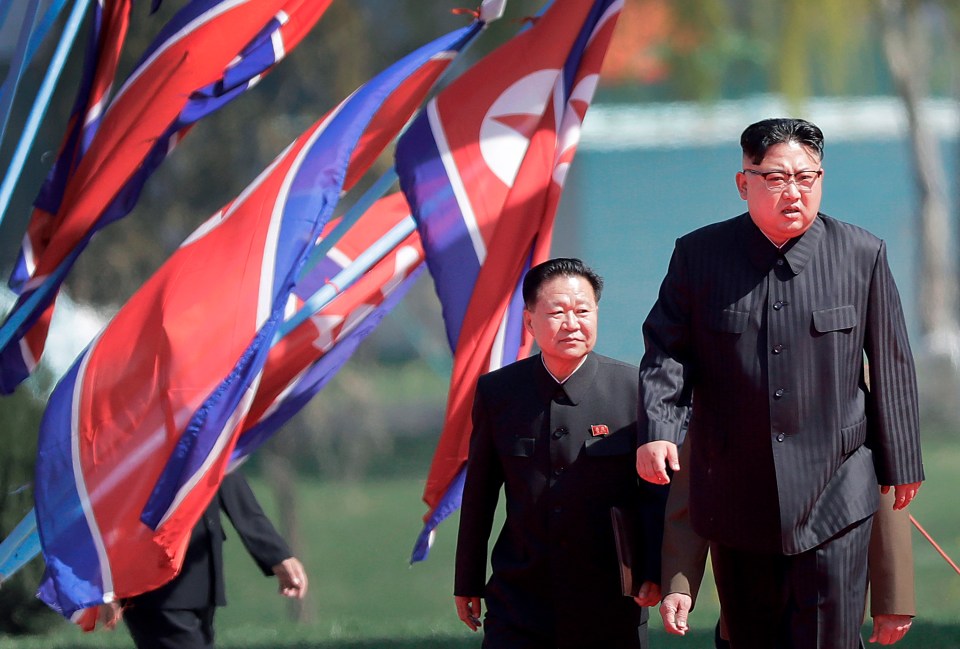  Mr Choe's father, left, joined the Korean People's Army in 1967