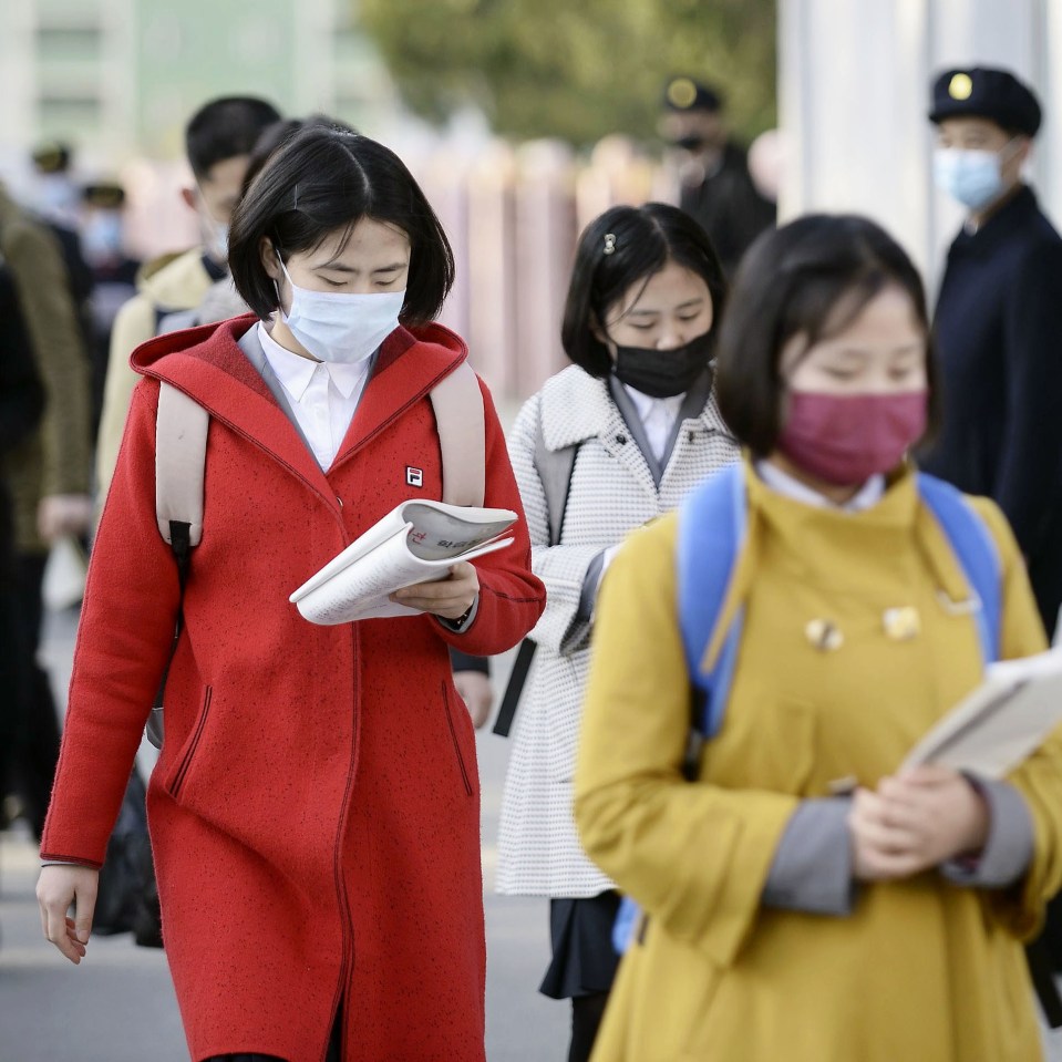  South Korea has suggested Kim may be in hiding due to coronavirus. North Korean students walk to university on April 22.