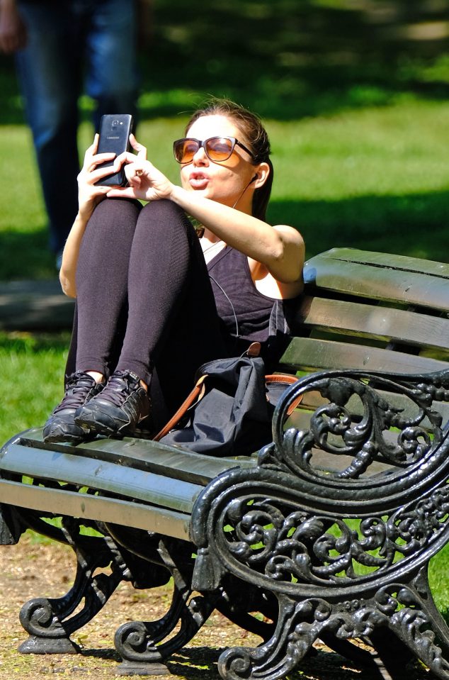  A woman was seen enjoying the sunshine in Hyde Park today