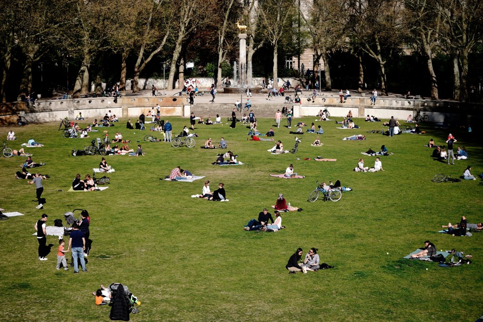  Many in Berlin sit in the Schoneberg city park while social distancing this week as Germany starts to lift lockdown measures