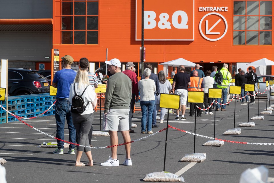  Shoppers queue outside B&Q in Aberdeen after its reopening today