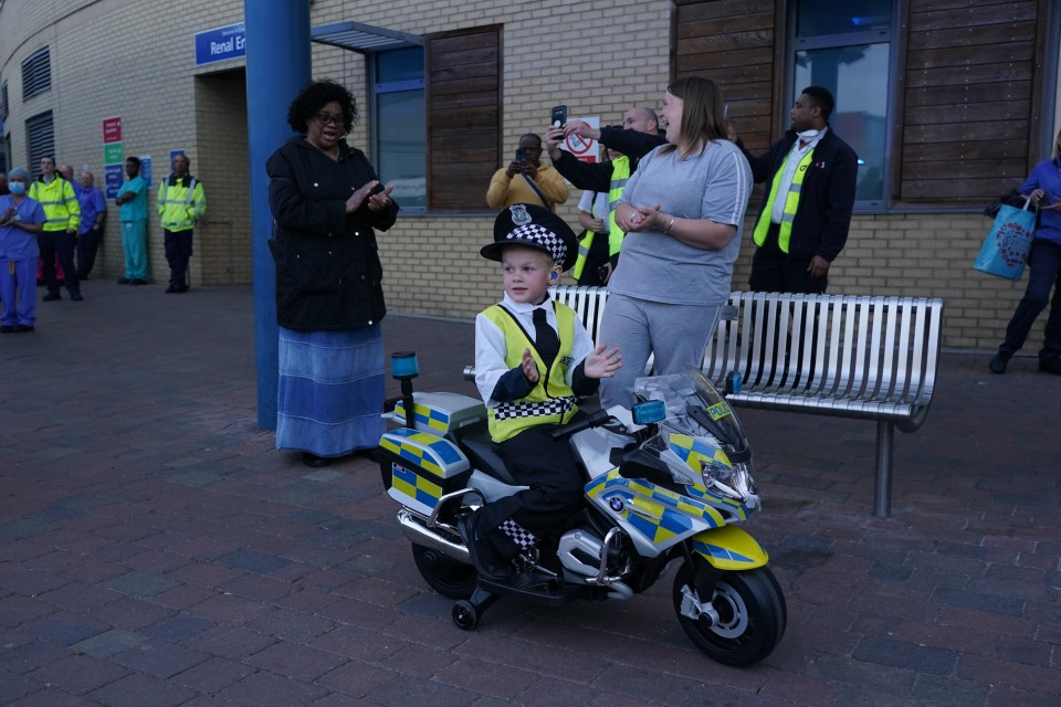  A boy dressed as a police officer takes part in the fifth Clap For Carers at Queen’s Hospital in Romford