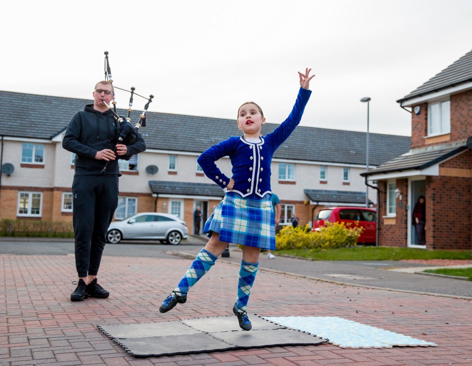  Highland dancer Isabella Hay dances for the NHS outside her home at Kingston Dock, Port Glasgow