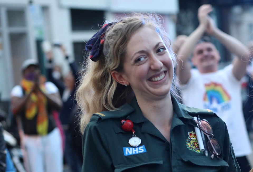  An NHS worker reacts outside Chelsea and Westminster Hospital during the Clap For Carers