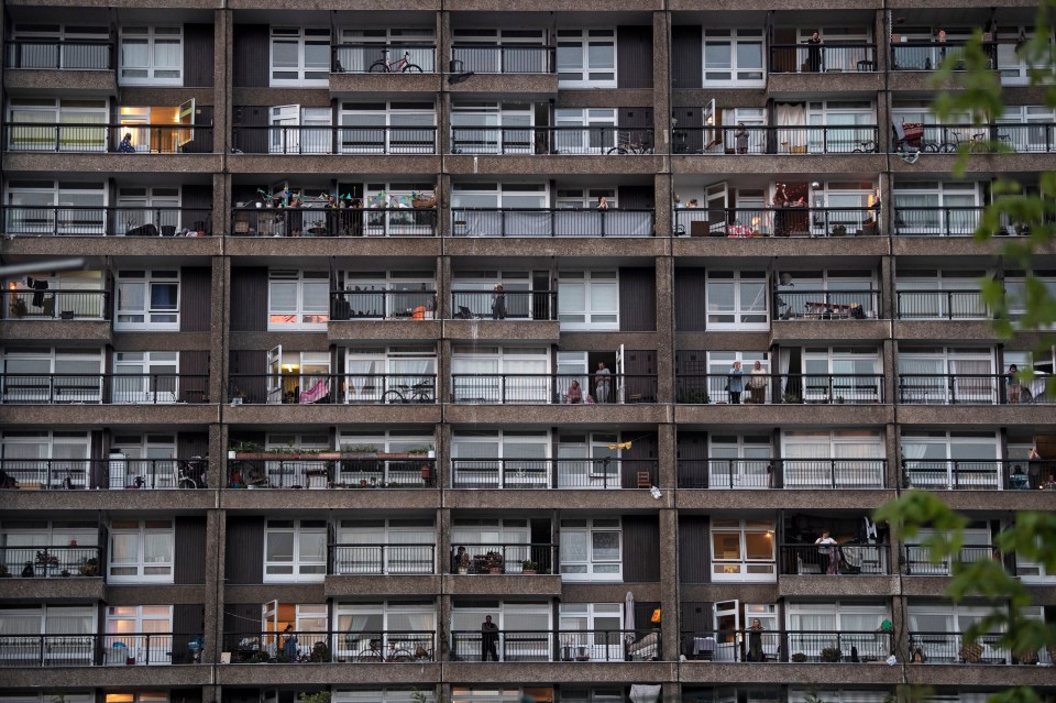  Residents of the Trellick Tower in west London take part in Clap For Carers