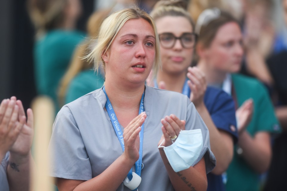  An NHS worker in tears outside at Whiston Hospital in Merseyside during the fifth Clap For Carers