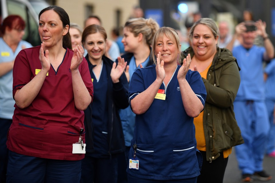  Staff at the Queen Elizabeth Hospital in Glasgow applaud to show their appreciation for National Health Service