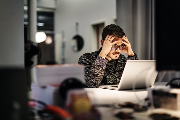 Man worried at computer