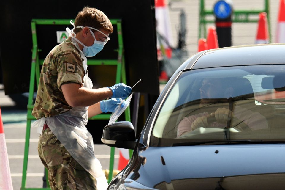  British Army personnel at a drive-in testing facility at Manchester airport on April 24