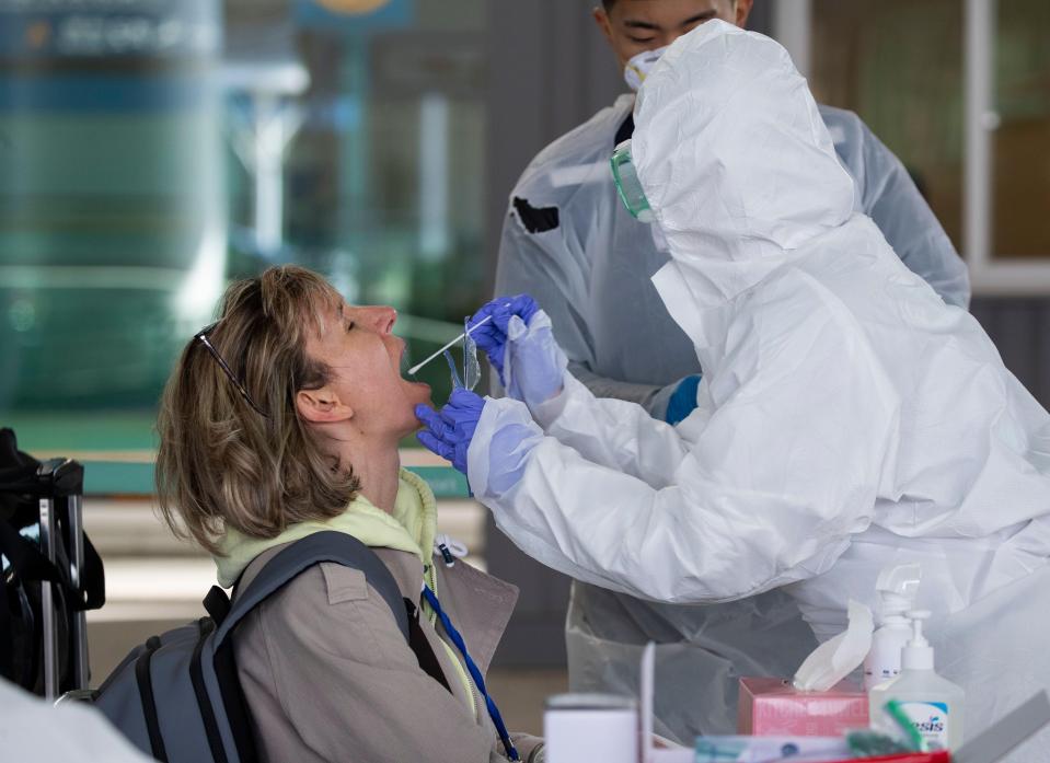  A passenger travelling from Europe is tested at Incheon international airport, South Korea