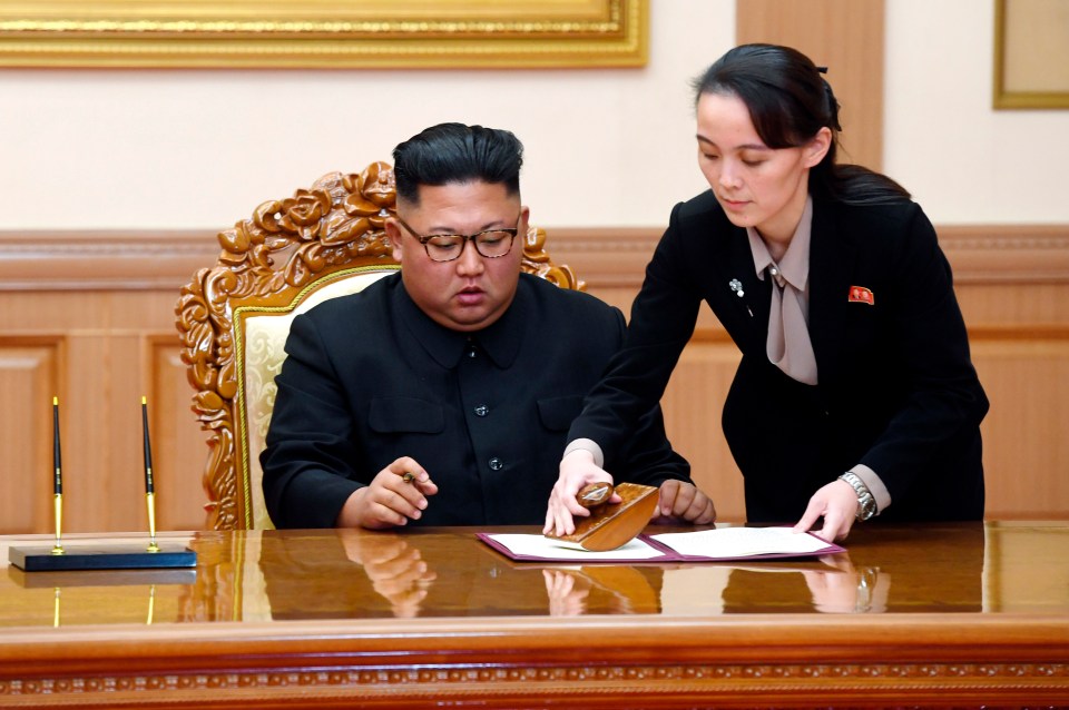  Kim Yo-jong helps her brother sign a joint statement with South Korea on September, 19, 2018