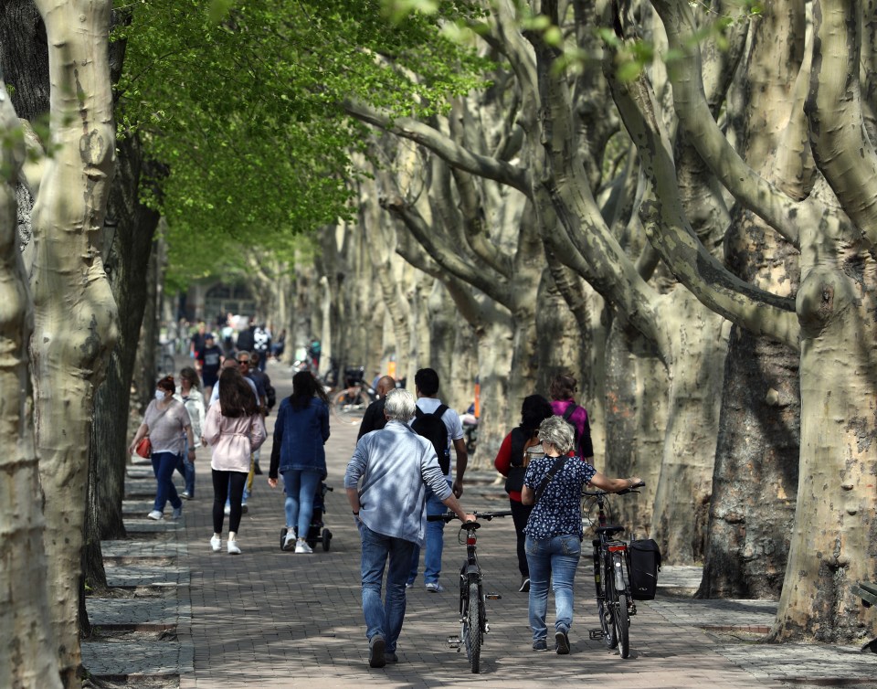  People enjoy the sun in Berlin this week after Germany eased its lockdown