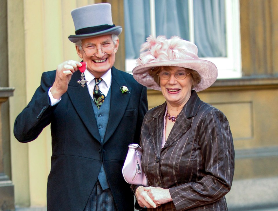  Peter receiving an MBE with his late wife Margaret