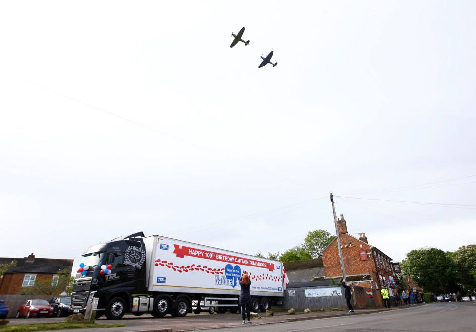  RAF planes fly past the house of army veteran Captain Tom Moore marking his 100th birthday as a truck displays a birthday message